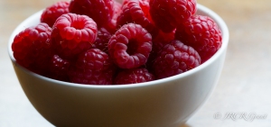 Raspberries in a white china bowl